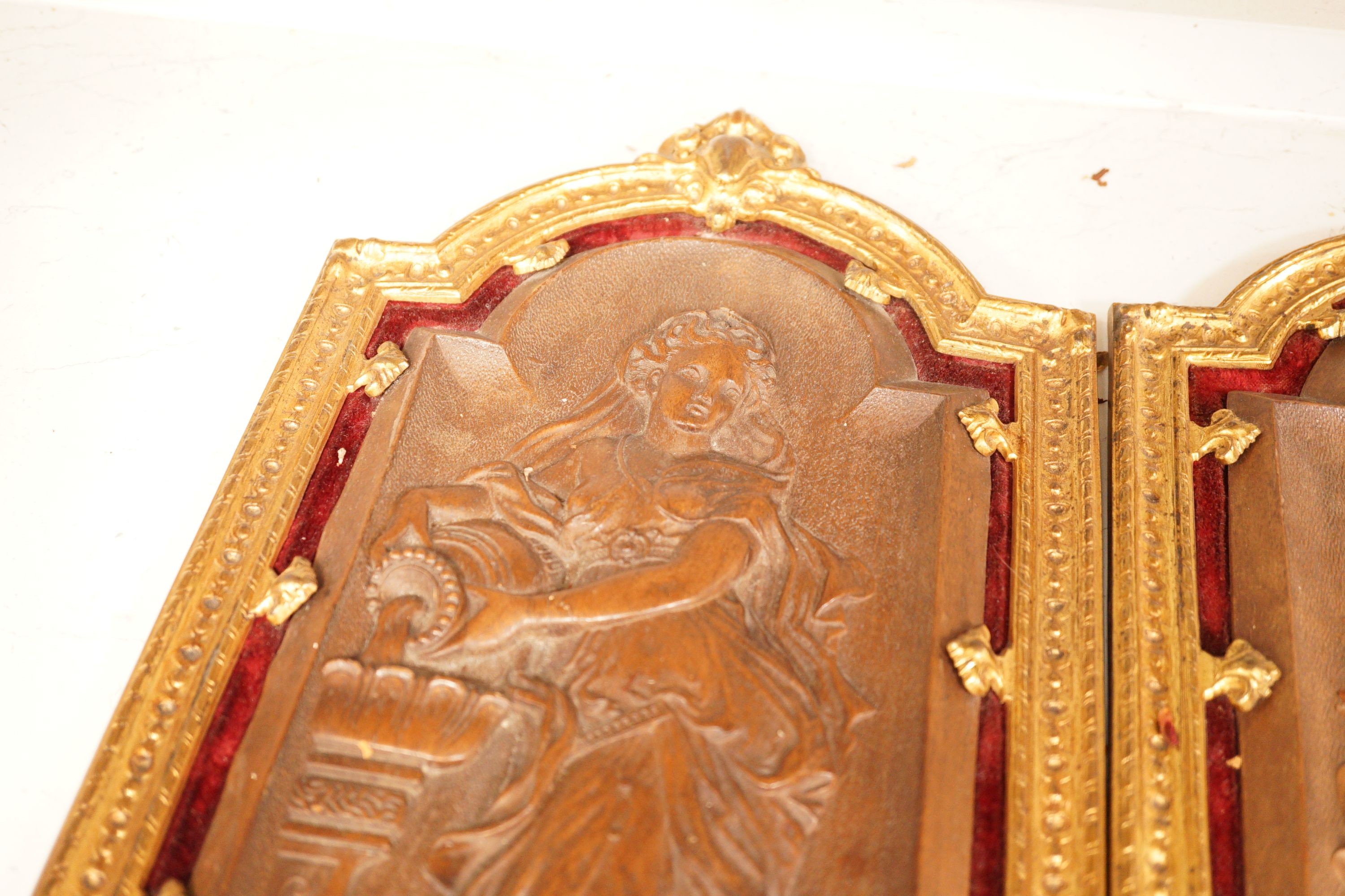 A pair of 19th century French ormolu mounted bois durci plaques, 50cm